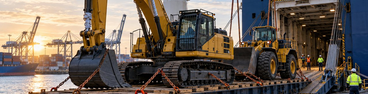 Heavy machinery being loaded for ocean transport